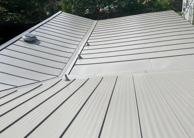 Solar attic fan installed on a metal roof for Roof Ventilation in Scottsdale